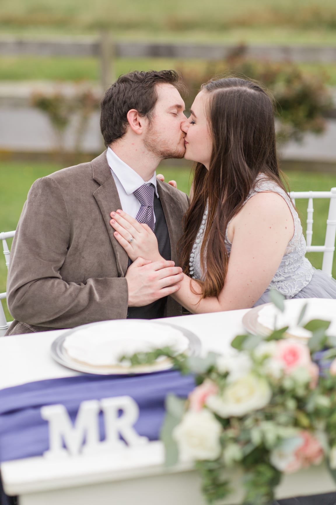 Bride & groom kiss Wedding portrait on a path at 'Four Winds at North Mountain' in Swoope VA