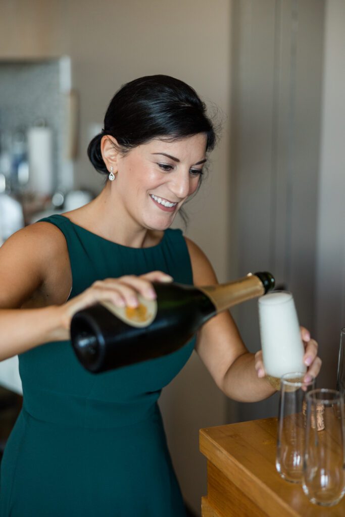 Epicurean Hotel Tampa Florida wedding photography bride and groom pouring champagne