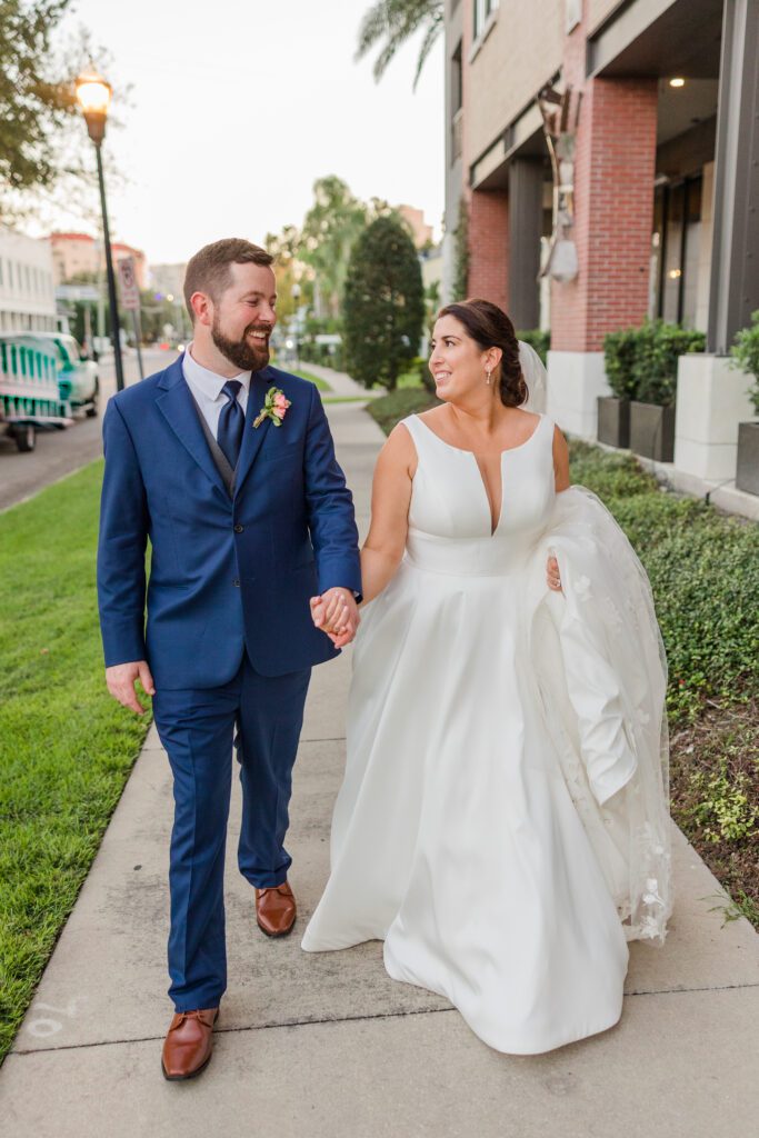 Epicurean Hotel Tampa Florida wedding photography bride and groom walking sidewalk